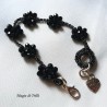 Braccialetto donna con fiori di cristalli neri intrecciati con filo per gioielli argentato