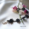 Braccialetto donna con fiori di cristalli neri intrecciati con filo per gioielli argentato
