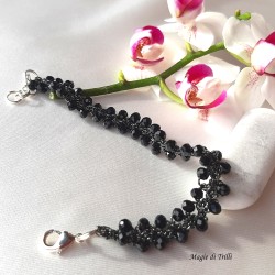 Braccialetto donna con cristalli neri intrecciati con filo per gioielli argentato